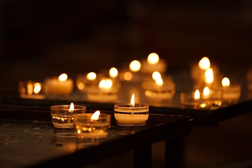 Candles and tealights in a prayer corner